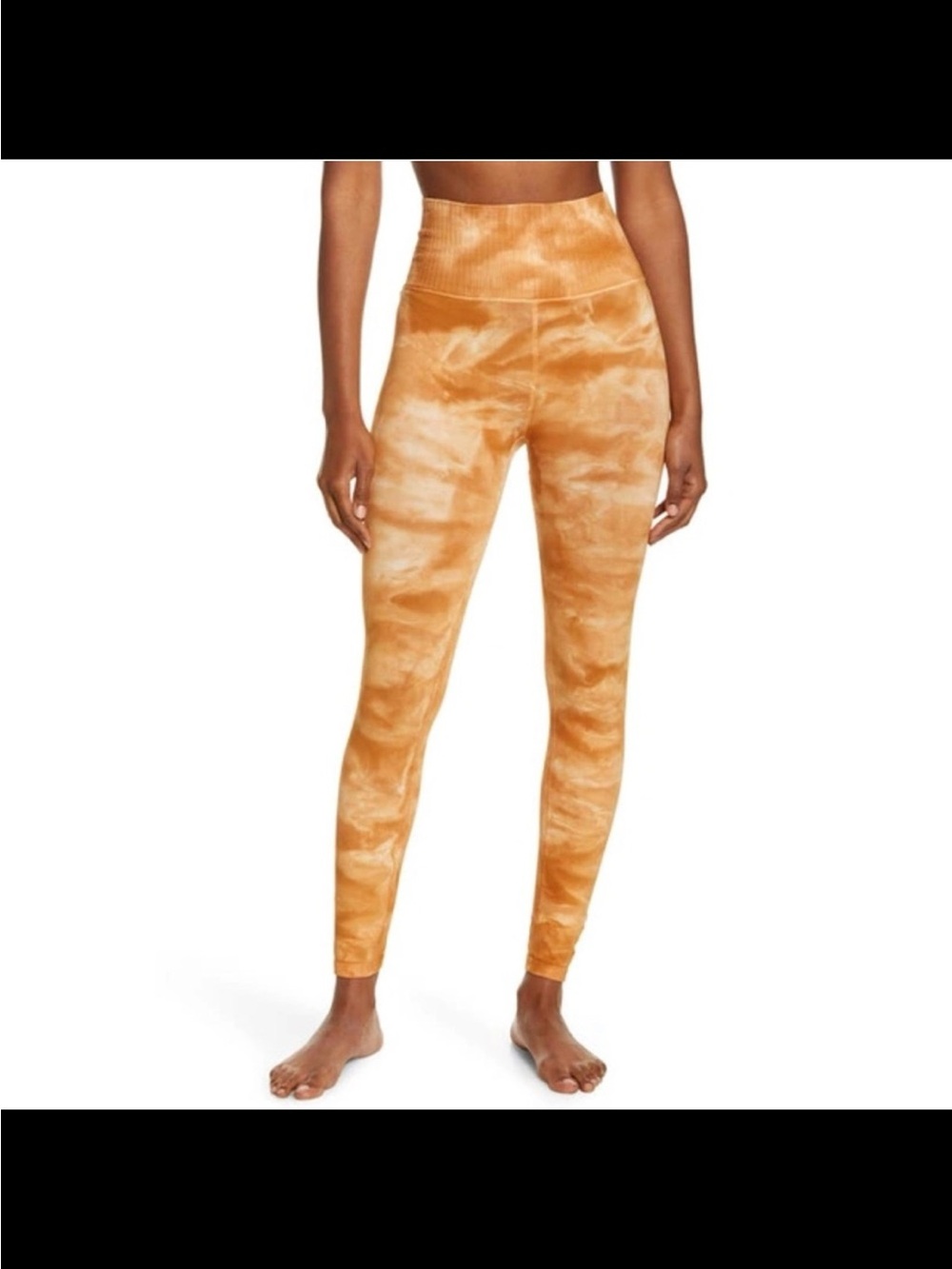 Free People Movement Good Karma tie-dye leggings in a burnt topaz color medium